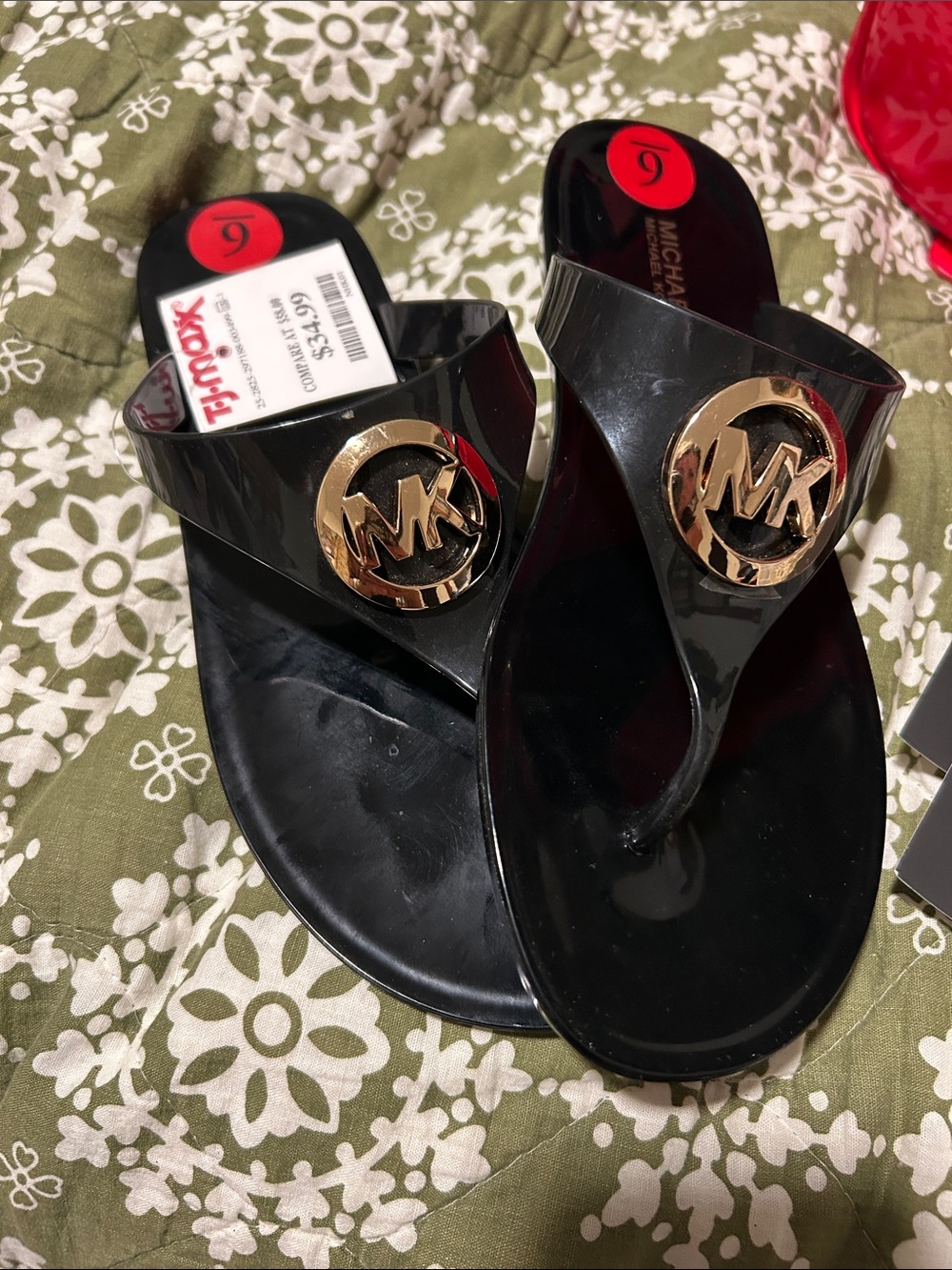 Michael Kors Black Glossy Jelly Flip Flops with Gold MK Medallions